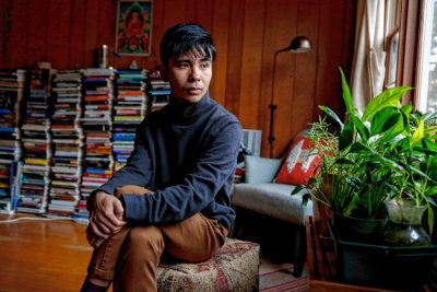 Ocean Vuong, a poet who teaches at UMass Amherst, sits for a portrait Nov. 14, 2017 in his Florence home.