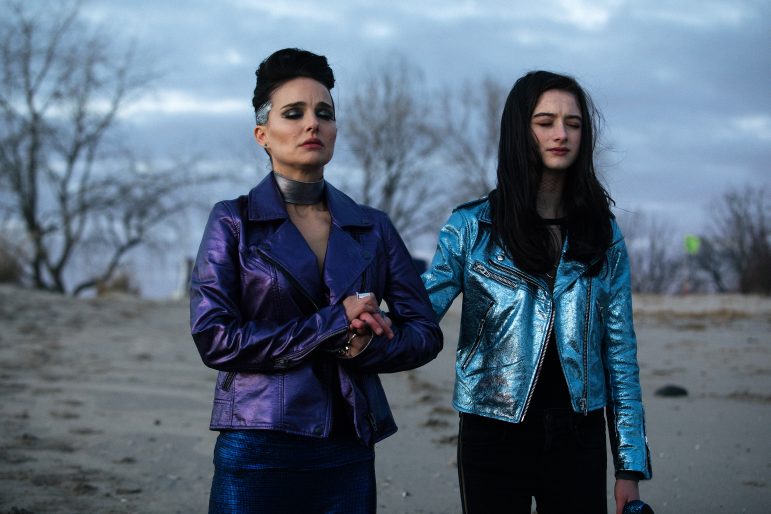 Pop sensation Celeste (Natalie Portman), left, prays with daughter Albertine (Raffey Cassidy) in Vox Lux. Photo courtesy of Rolling Stone.