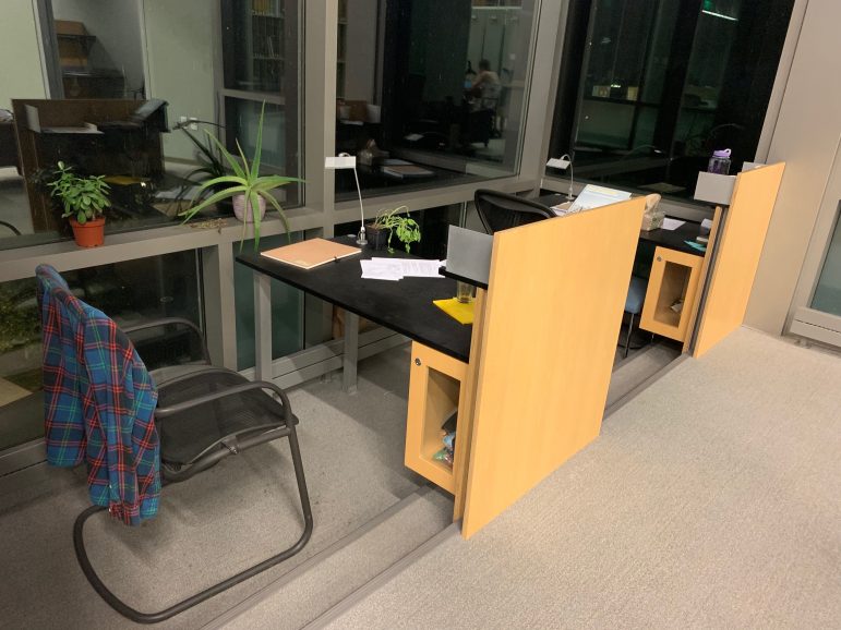 After camping out overnight,  seniors make carrels their own