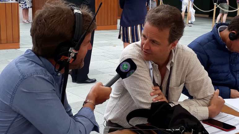 Christopher Clarey ’86 talks to a colleague from the Wimbledon Radio Show during last year’s tournament. (Photo courtesy of Christopher Clarey.)