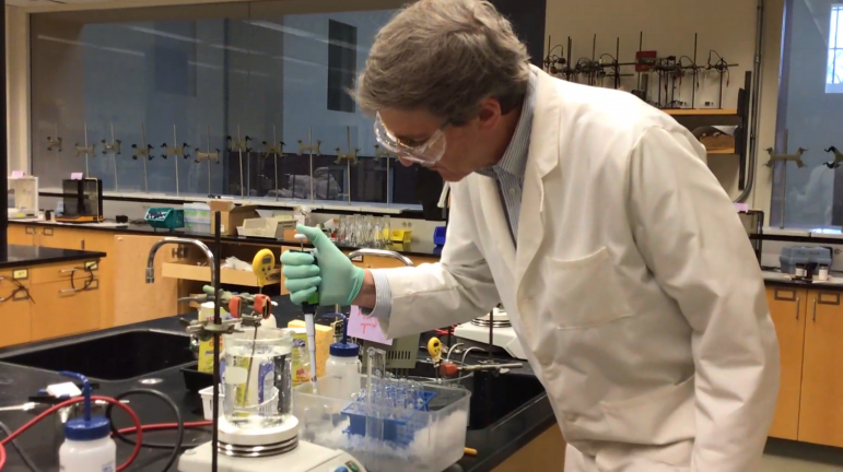 Professor Thoman records himself doing the laboratory experiments for his chemistry students. (Photo courtesy of Jay Thoman.)