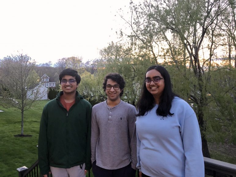 Shreyas Rajesh 22, an international student from India, poses with Nandini Seetharaman 22 and her brother at their home in Massachusetts. Rajesh decided to stay with Seetharaman and her family after the Indian border closed. (Photo courtesy of Shreyas Rajesh.)