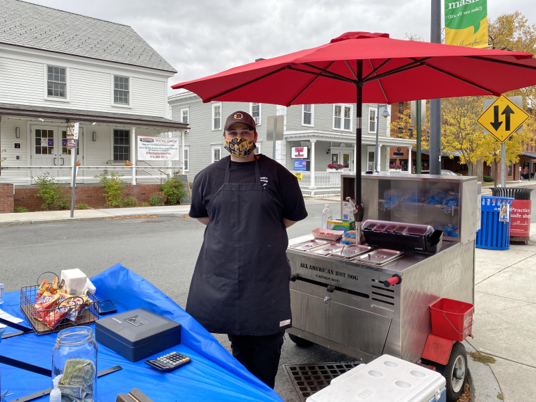 Staff members start Spring Street hot dog stand