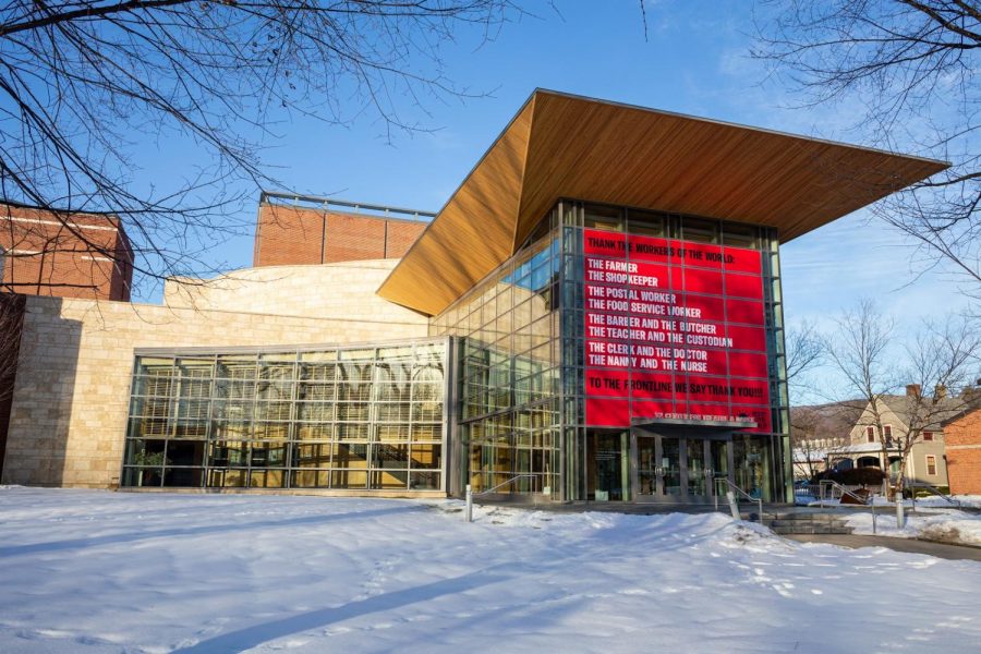 The ’62 Center for Theatre and Dance is the site of several installations of Carrie Mae Weems’ campaign “Resist COVID / Take 6!” such as this “red box” banner thanking frontline workers. (Photo courtesy of Brad Wakoff.) 