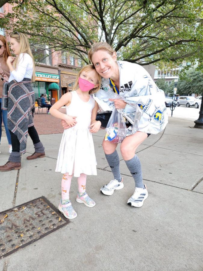 After running her fourth Boston Marathon, Jessica Chapman poses for a picture with her daughter, Mia. (Photo courtesy of Jessica Chapman.)	