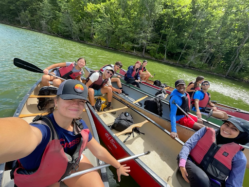 Michael Ma ’26 (center back) poses with his BASE CAMPus group while canoeing on Grafton Lake. (Amina Naidjate/ The Williams Record).