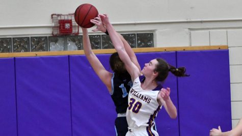 Maddy Mandyck ’22.5, a fifth-year on women’s basketball, blocks a shot. (Photo courtesy of Sports Information.)