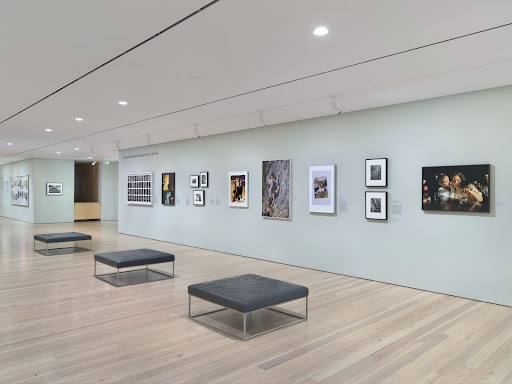 Installation view of Trust Me (Whitney Museum of American Art, New York, August 19, 2023-February 2024). From left to right: Moyra Davey, Trust Me, 2011; Laura Aguilar, Nature Self Portrait #6, 1996; Dakota Mace, Béésh Łigaii II, 2022; Genesis Báez, Crossing Time, 2022; Alvin Baltrop, The Piers (collapsed architecture, couple buttfucking), 1979; Barbara Hammer, Barbara & Terry, 1972; Laura Aguilar, Plush Pony #2, 1992; Lola Flash, Untitled, Provincetown, MA, 1990; DAngelo Lovell Williams, Elysian, 2018; Mary Manning, His Estate, 2022; Jenny Calivas, Self-Portrait While Buried #12, 2021; Jenny Calivas, Self-Portrait While Buried #16, 2021; Genesis Báez, The Sound of a Circle, 2018. (Photo courtesy of Ron Amstutz.)