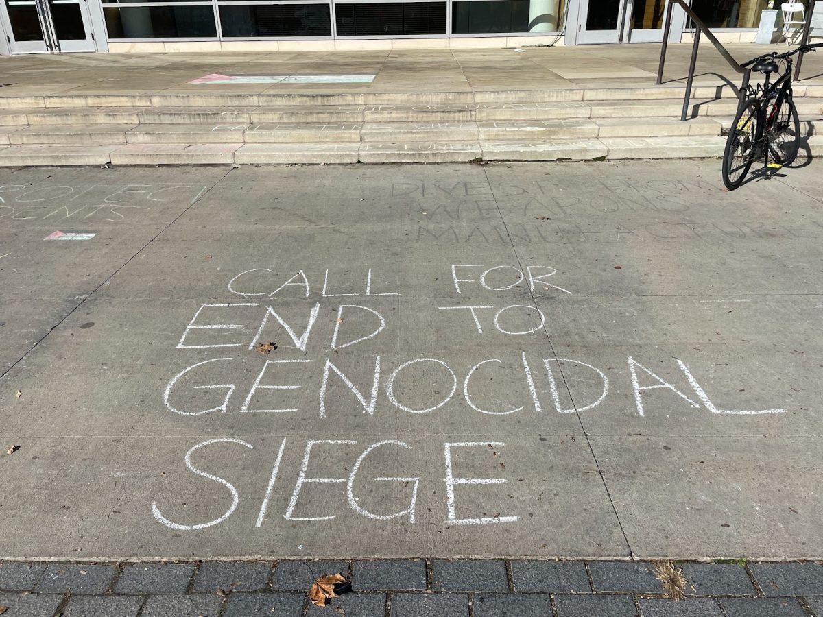 Students chalked the walkway in front of the Paresky Center with statements and a Palestinian flag ahead of the protest on Wednesday. (Luke Chinman/The Williams Record)
