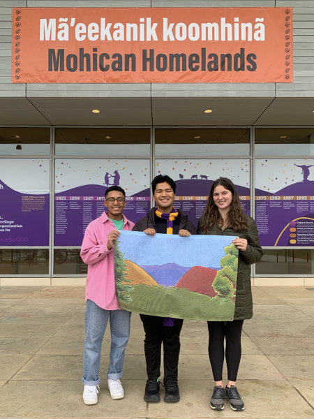 Jogwe, Hayakawa, and Chilcoat under the Mohican Homelands banner. 
(Photo courtesy of Jayden Jogwe)