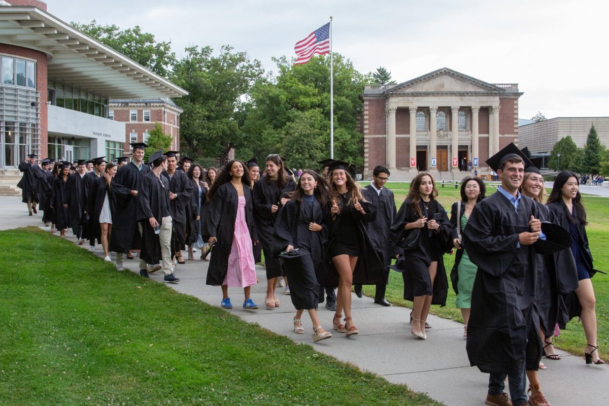 Seniors at the College walked down Paresky Lawn in their caps and gowns during Convocation on Sept. 7.