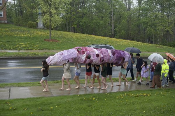 Students parading the Giant Daikon Radish past the Spencer Art Studio. (Photo courtesy of Beneyam Hassen and Beza Lulseged.)
