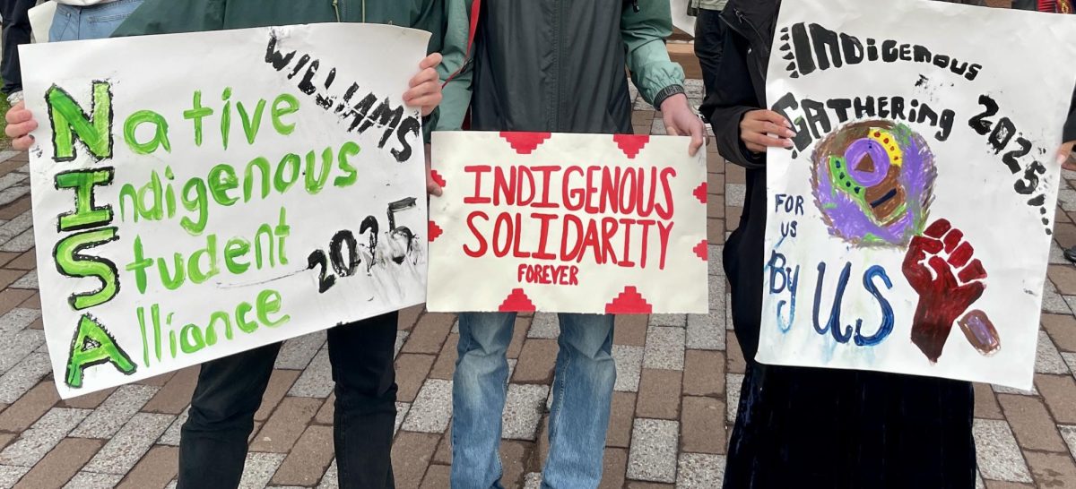 Students holding posters in front of Hopkins Hall during the Unity Walk. (Photo courtesy of Daisy Rosalez.)