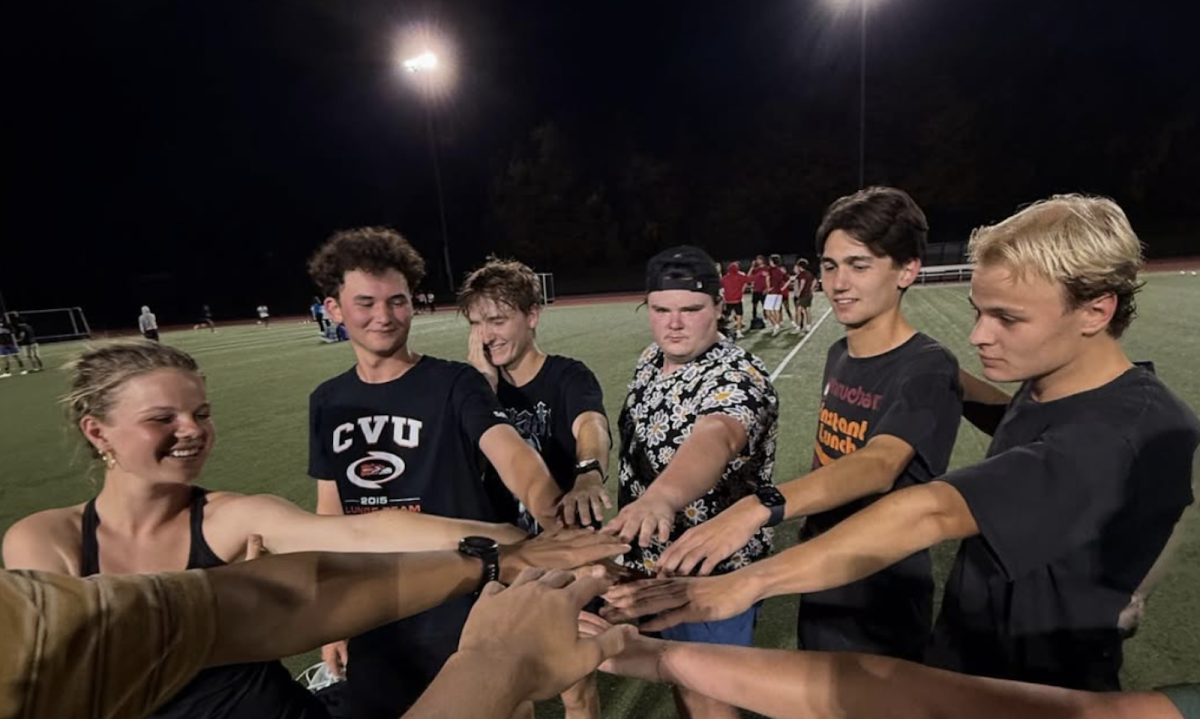 The IM soccer team Moo Crew prepares to take the pitch with a team-building ritual. (Photo courtesy of @themoocrew2024 on Instagram.)