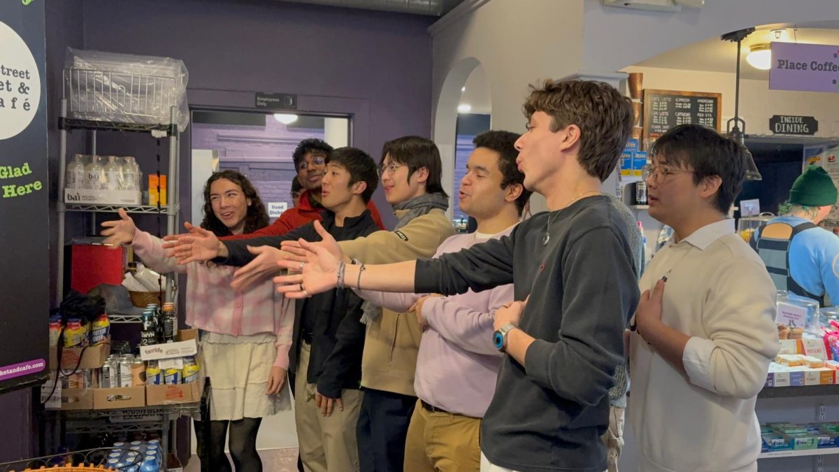 The Springstreeters deliver a singing telegram to the staff of Spring Street Market. (Rahma Ibrahim/ The Williams Record)