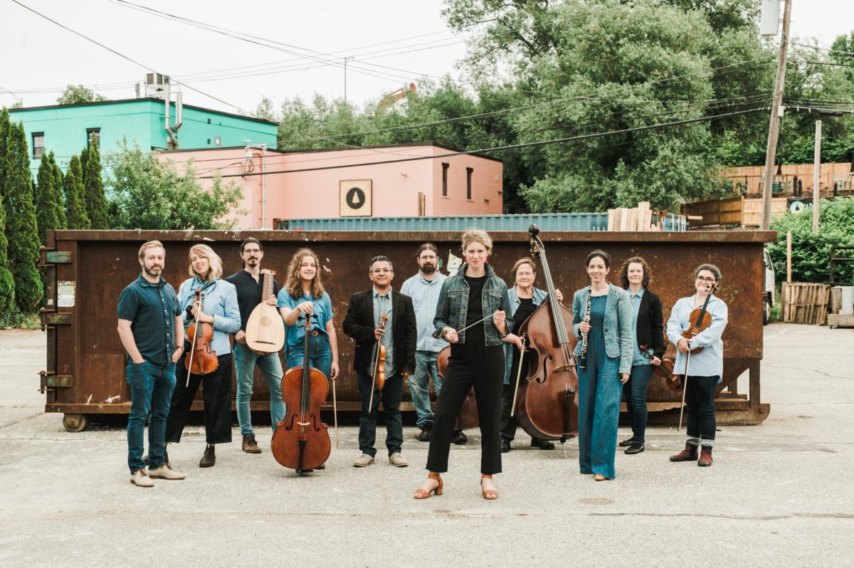 Isaacson and members of Classical Uprising poses with their string instruments. (Photo courtesy of Classical Uprising.)